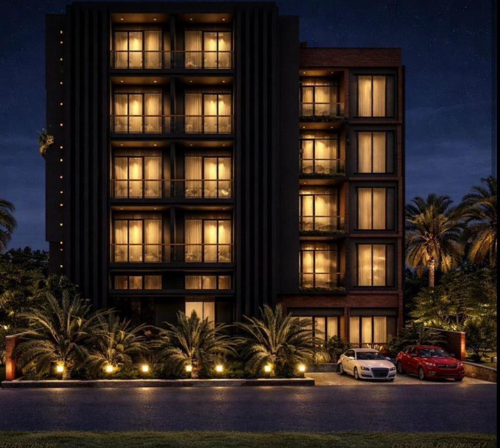 Dhahabu Apartments Kigali illuminated at night