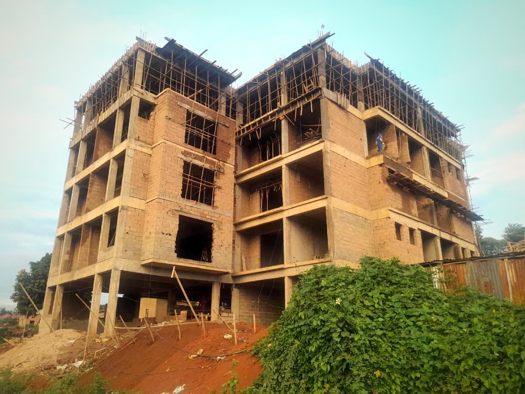 Dhahabu Apartments Kigali construction progress at golden hour