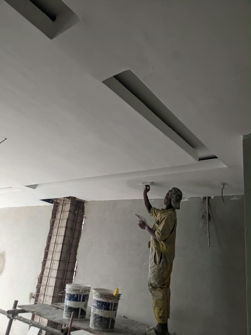 Ceiling screeding with light trough detailing in a Dhahabu living room, September 2026